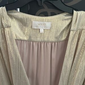 Gold wrap around gown. Strong v neck w ruffle bottom and elastic sleeve bottom.